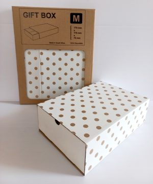 Image shows a gold polka dots gift box