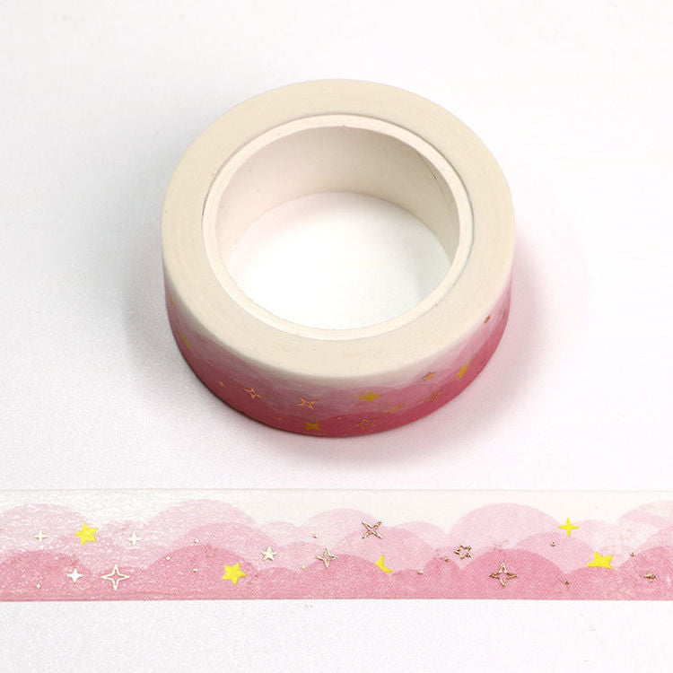 Image shows a washi tape with pink clouds and gold stars