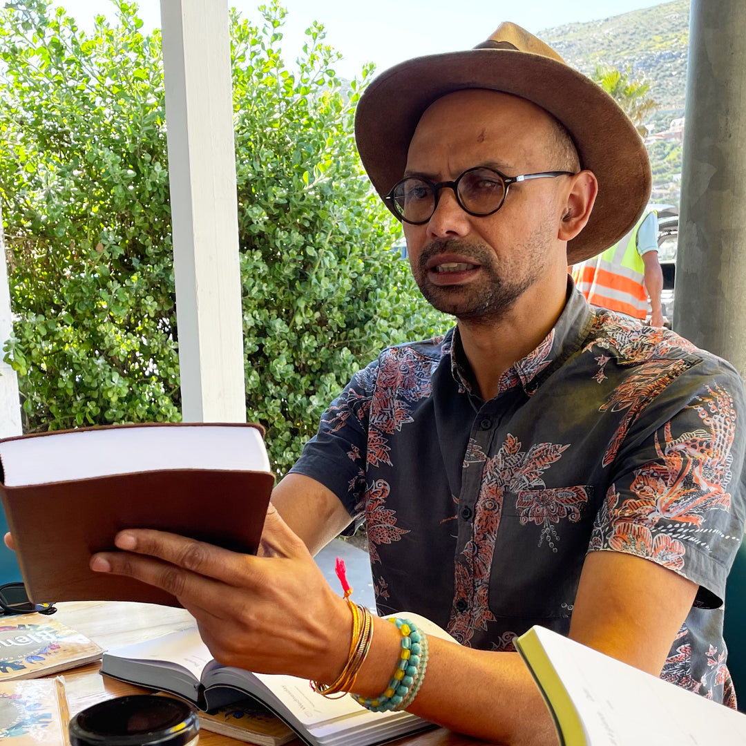 Image shows a man sitting with a Multiplanner in hand