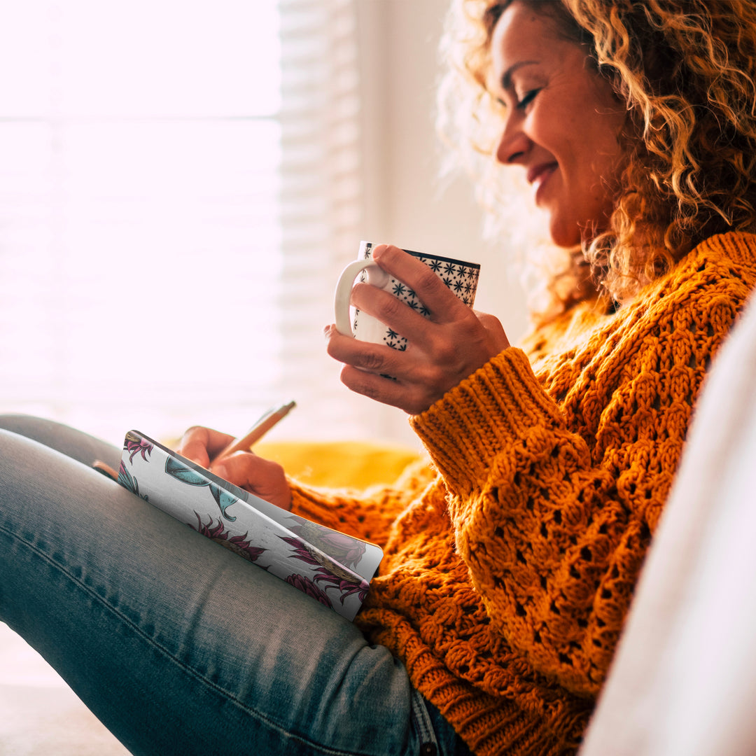 Image shows a woman writing in a Protea Multiplanner