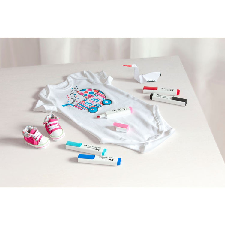 Image shows a set of Faber-Castell textile markers used on a baby vest
