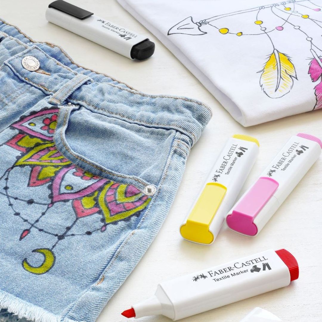 Image shows a set of Faber-Castell textile markers used on shorts