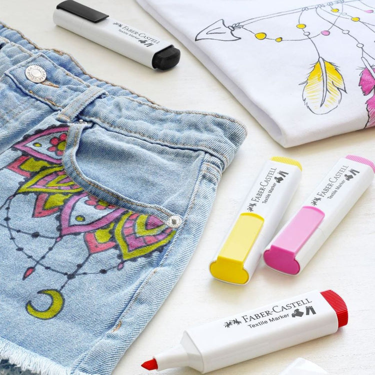 Image shows a set of Faber-Castell textile markers used on shorts