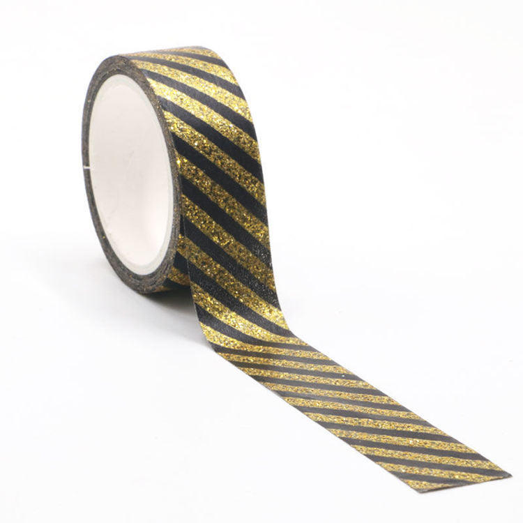 Image shows a glitter black and gold stripes washi tape