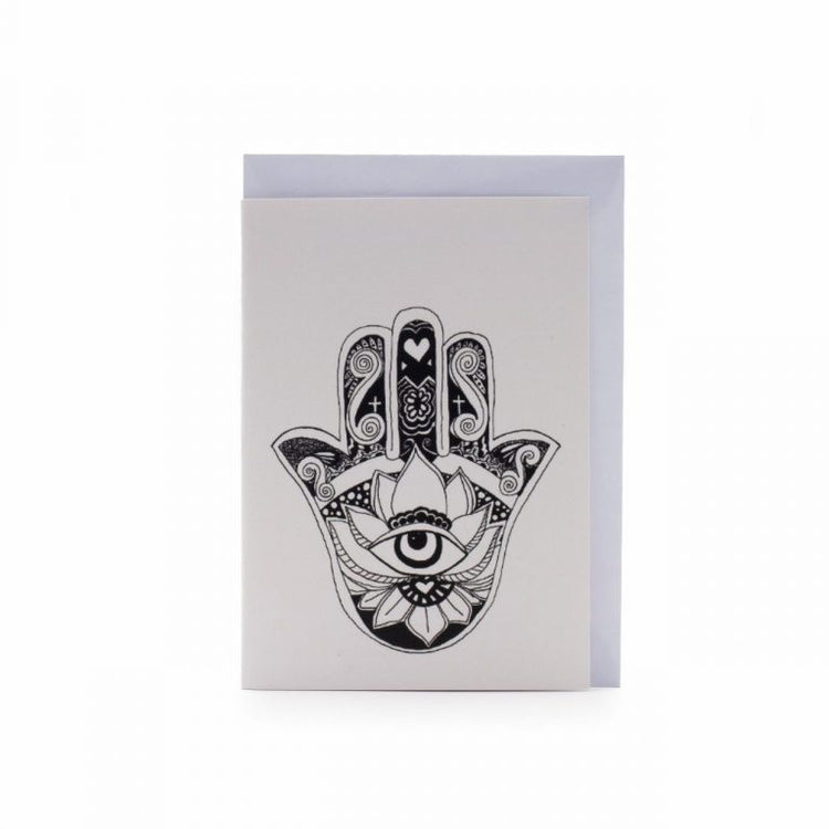 Image shows a greeting card with a "hamsa hand" illustration on it
