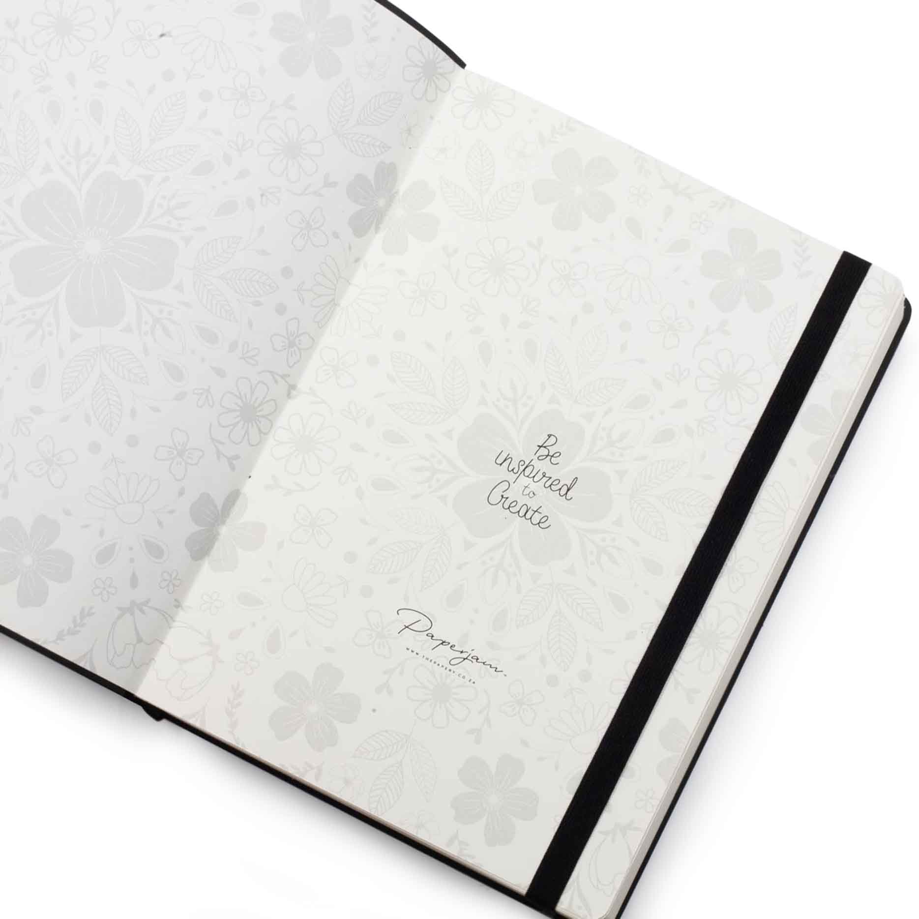 Image shows the endpapers of a black Flexi Premium journal