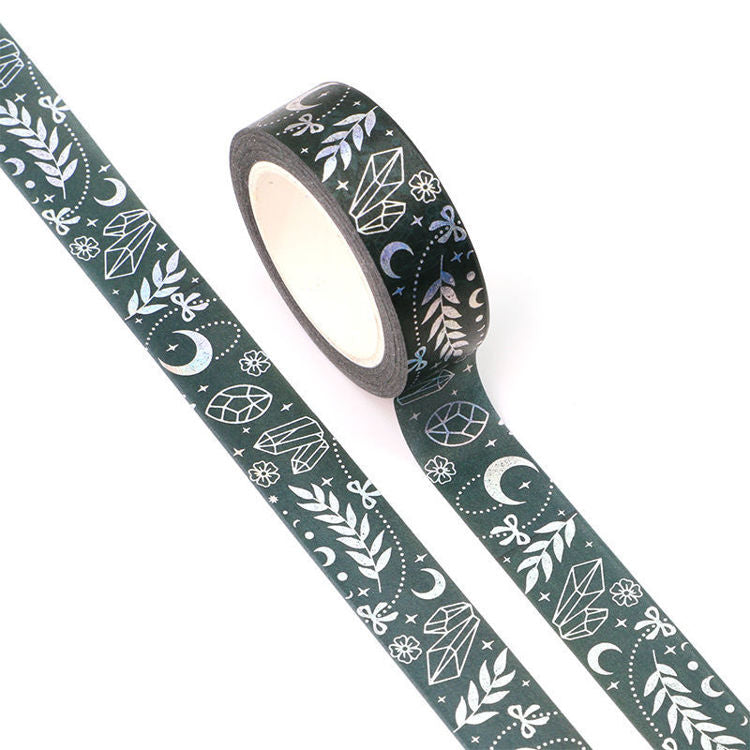Image shows a washi tape with a pattern of crystals and moons in foil
