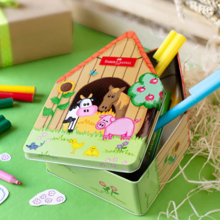 Image shows a farmhouse shaped tin with Faber-Castell pens 