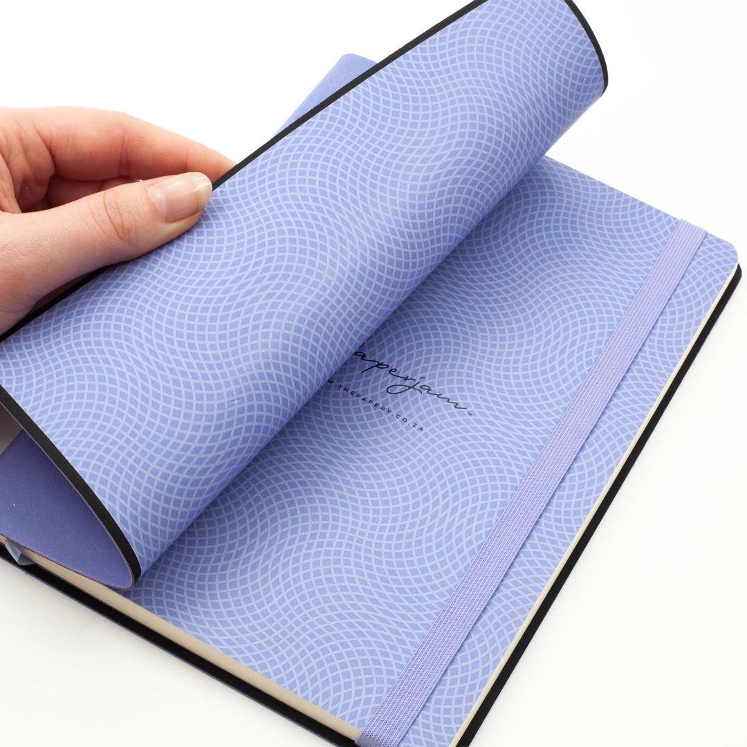 Image shows the endpapers of a lavender flexi journal