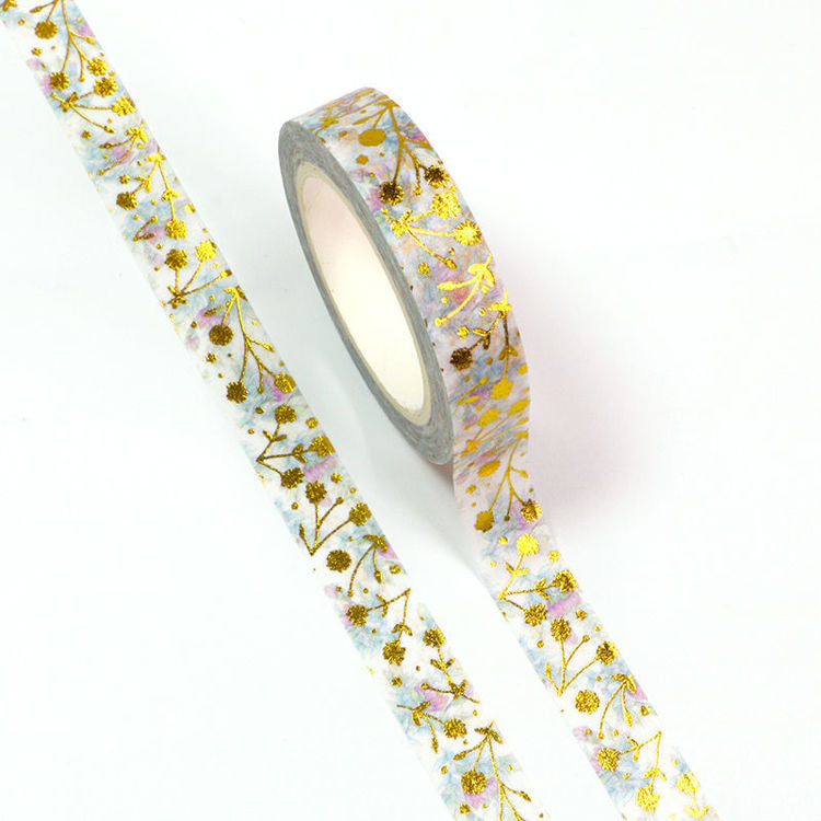 Image shows a washi tape with gold foil flowers