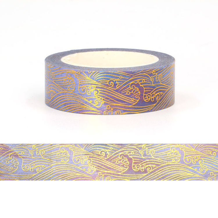 Image shows a washi tape with a gold wave pattern