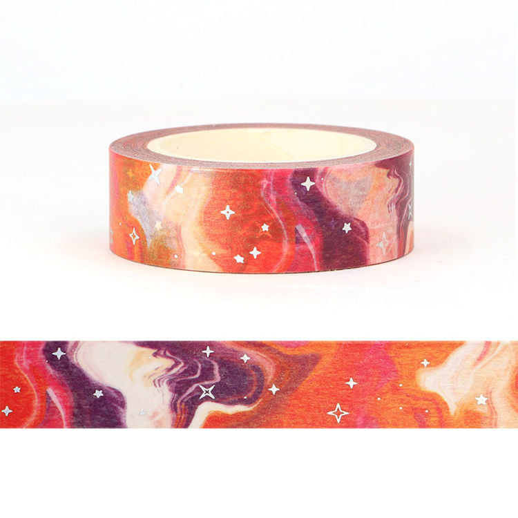 Image shows a wash tape with an orange galaxy pattern