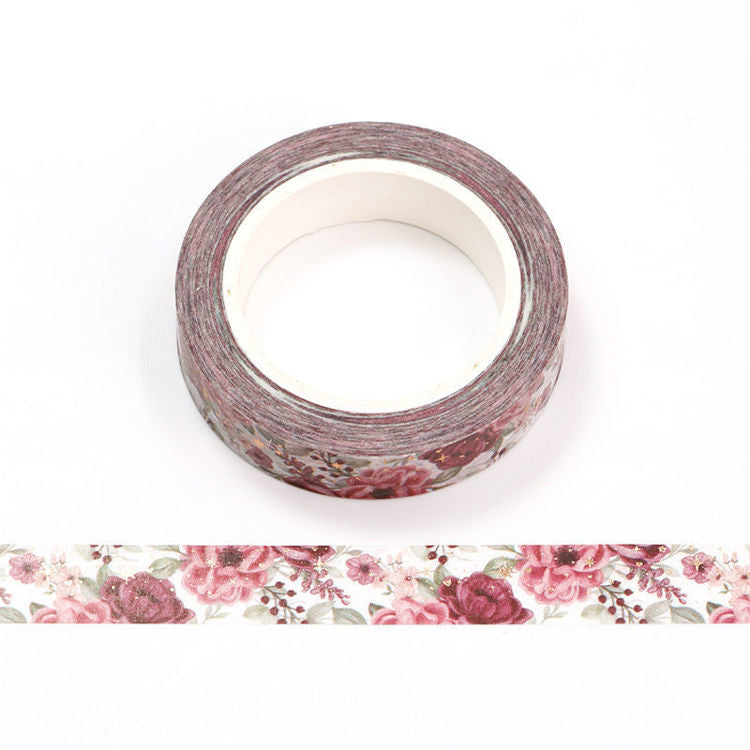 Image shows a washi tape with pink flowers and gold stars