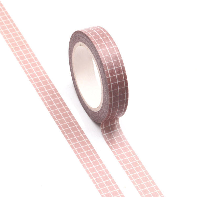 Image shows a washi tape with a  pink grid pattern 