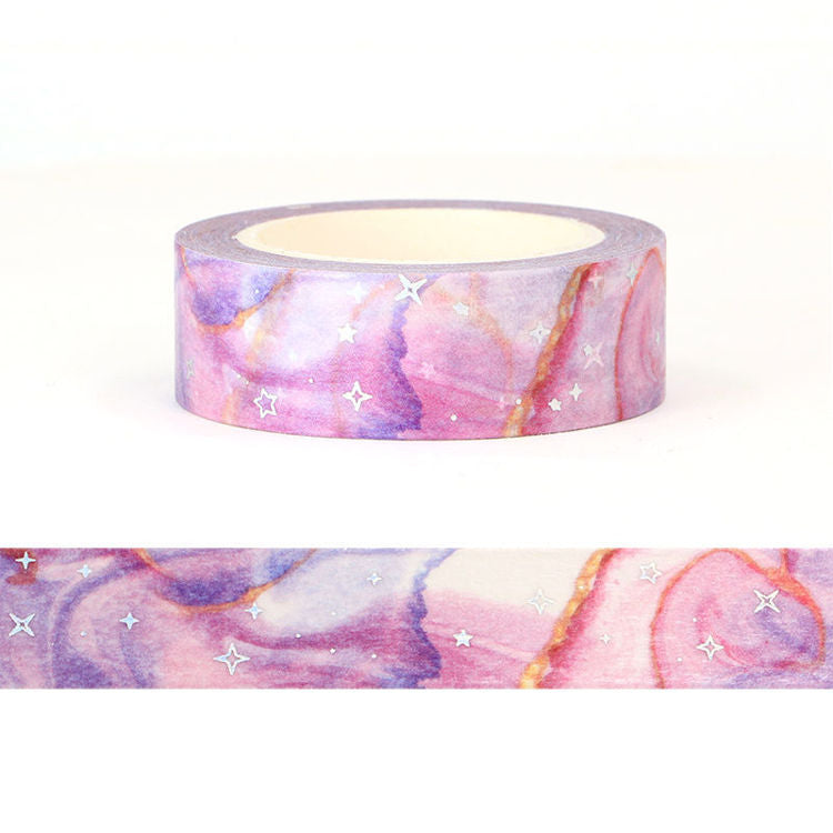 Image shows a washi tape with a purple galaxy pattern