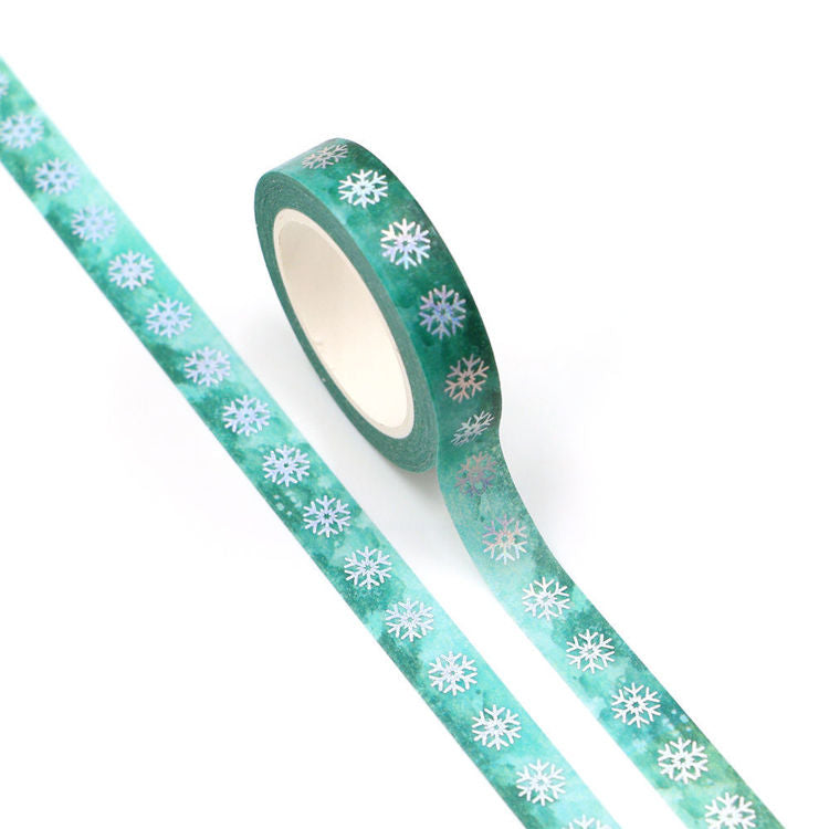 Image shows a green washi tape with silver foil snowflakes