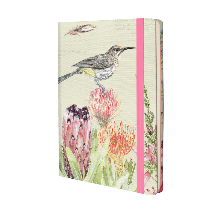Notebook with a bird and floral design on a light green background