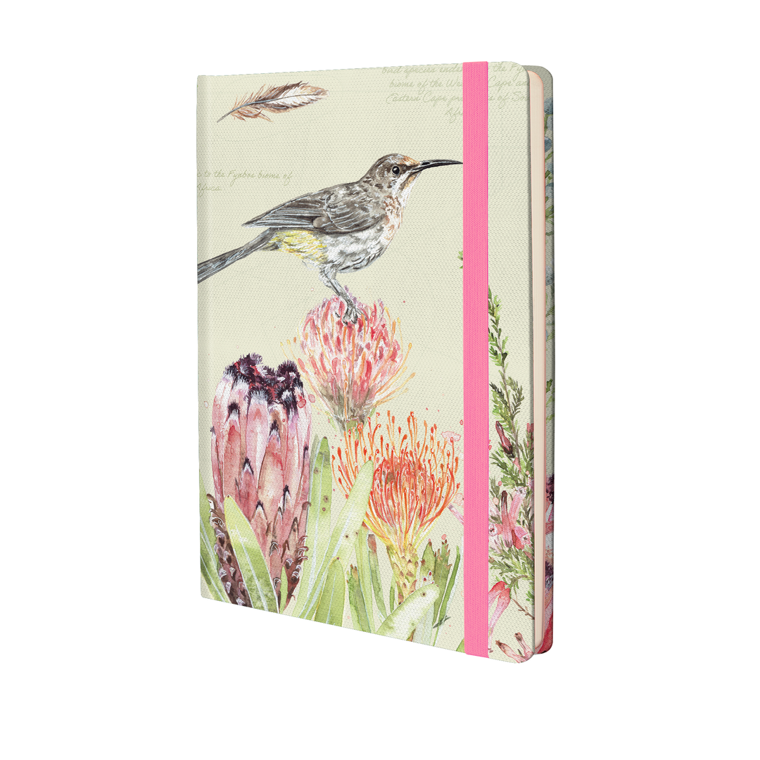 Notebook with a bird and floral design on a light green background
