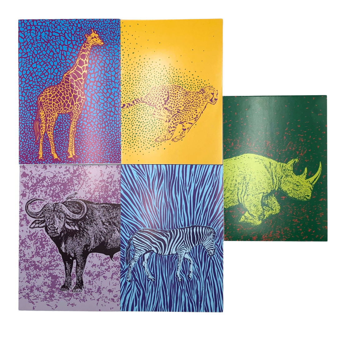 Set of five animal-themed notepads with colorful covers featuring a giraffe, cheetah, rhino, zebra, and buffalo.