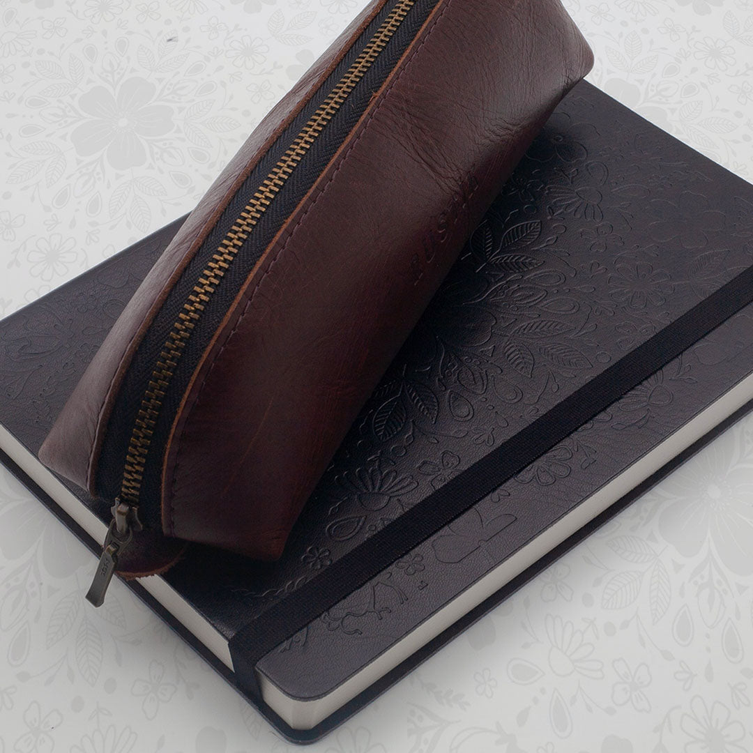 Image shows a Flexi premium journal and a Rustik Leather pencil bag 