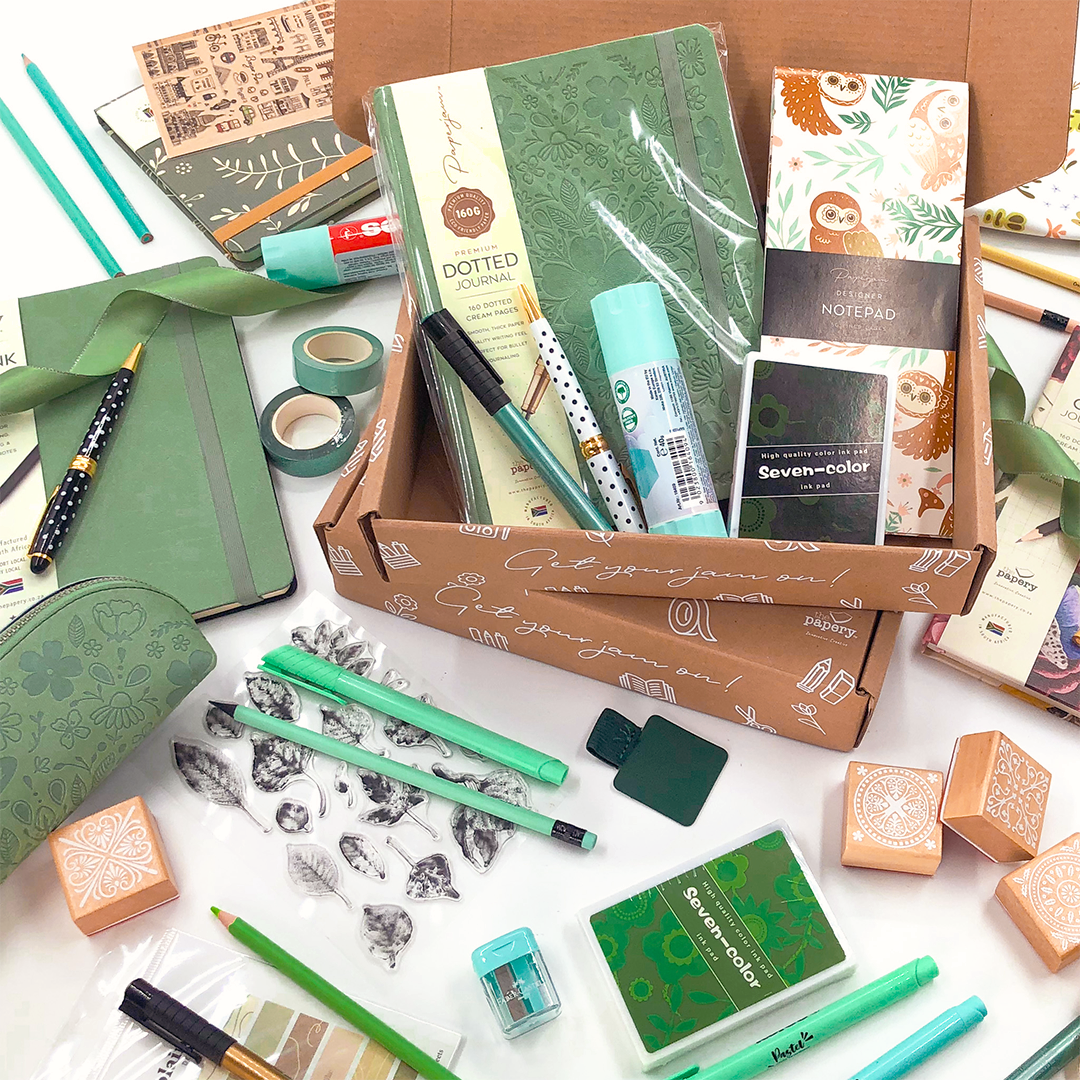 Image shows a stationery box with green themed stationery