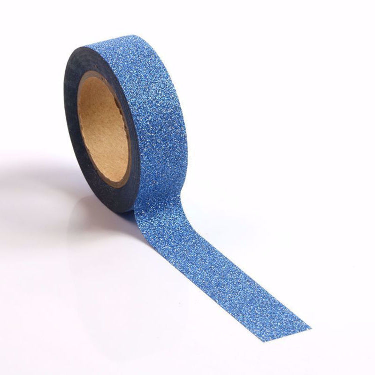 Roll of blue glitter washi tape on a white background