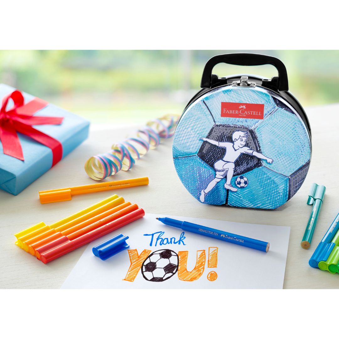 Image shows a soccer ball shaped tin with Faber-Castell pens