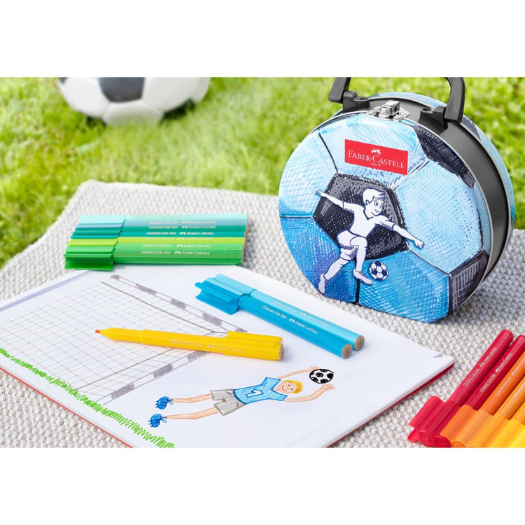 Image shows a soccer ball shaped tin with Faber-Castell pens