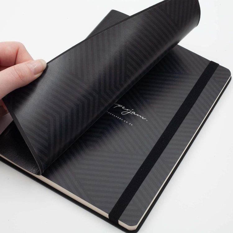 Image shows the endpapers of a black flexi journal