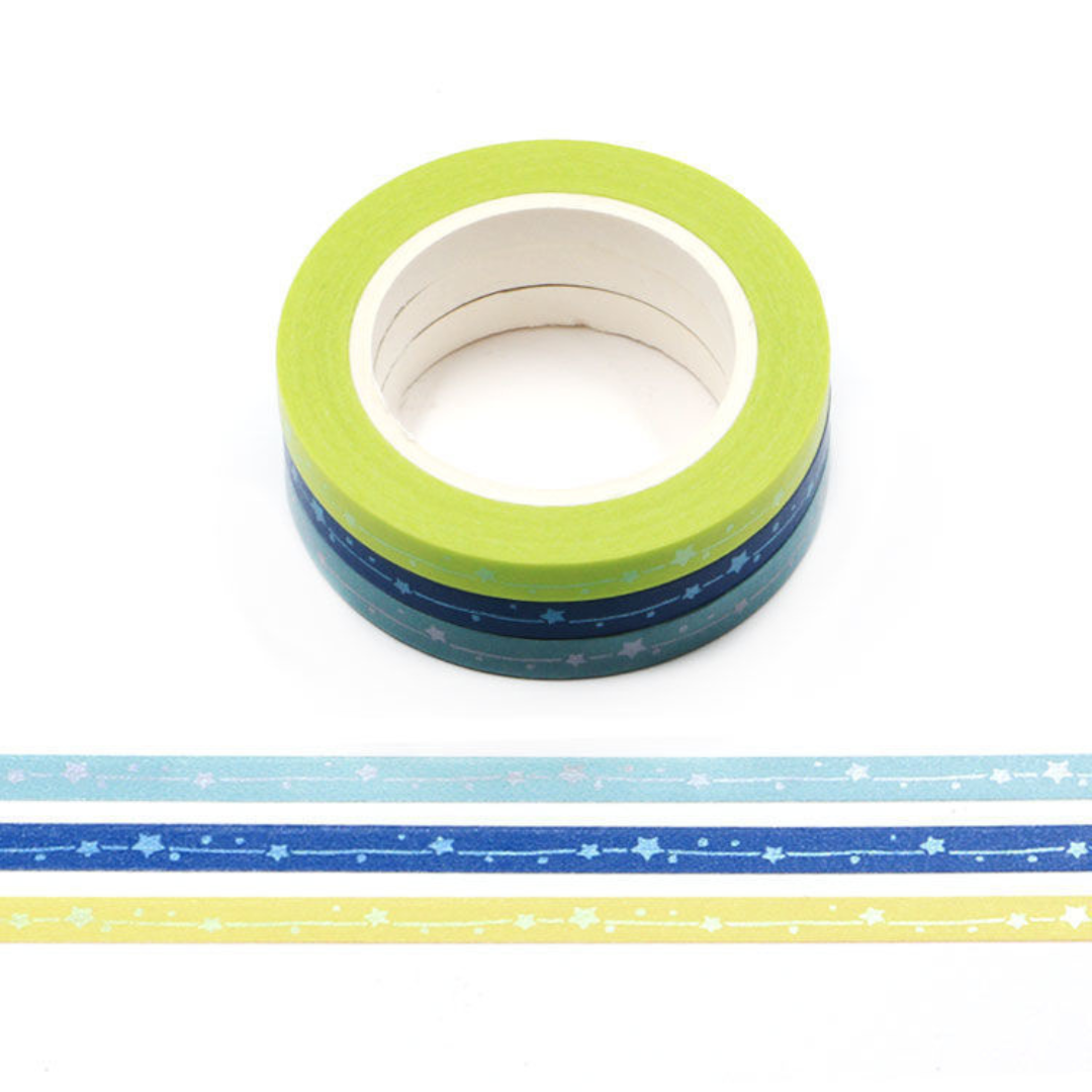 Three rolls of washi tape with shooting star patterns