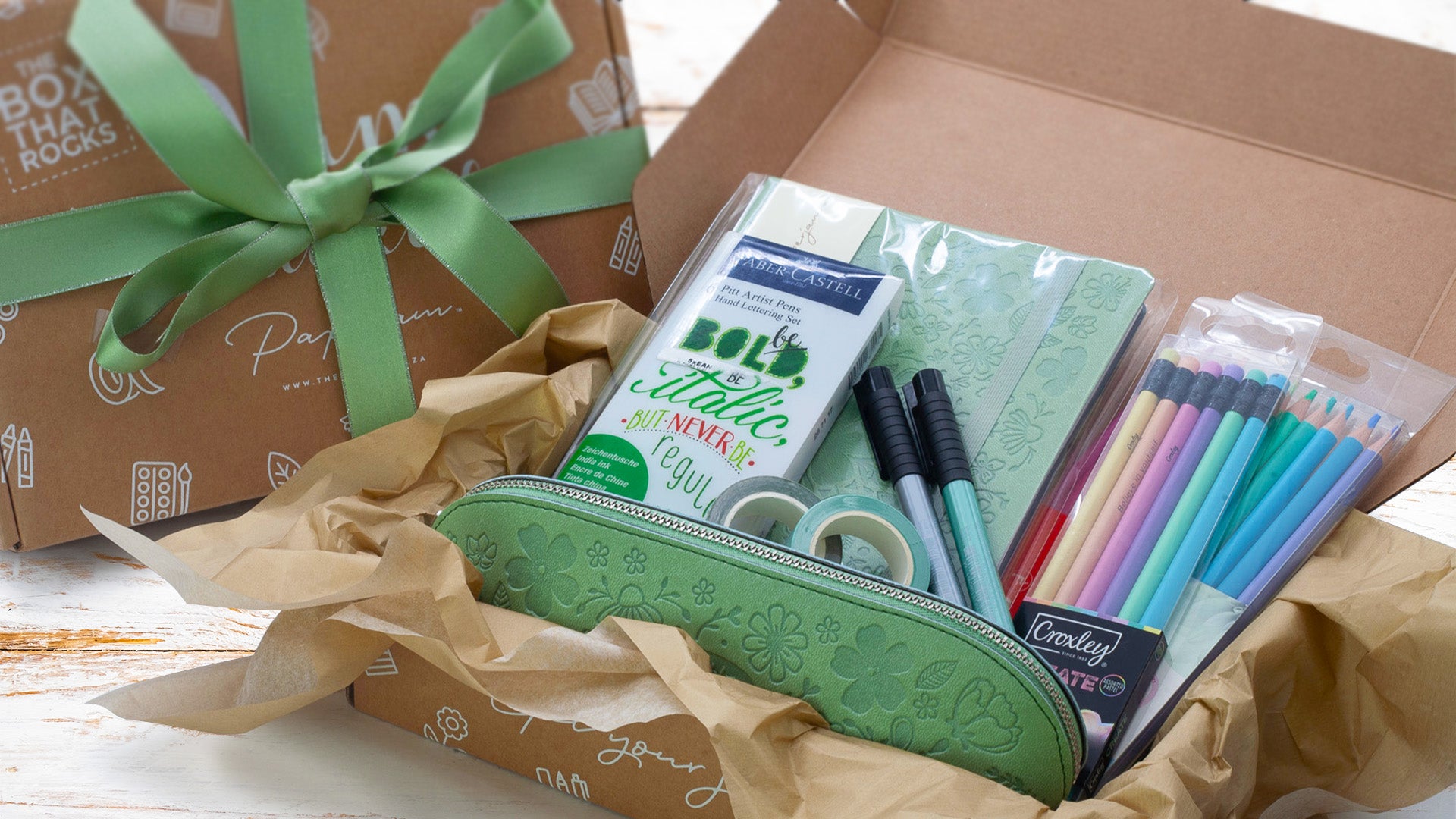 Image shows a build-a-box with a green stationery theme