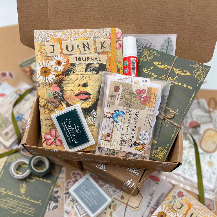 Image shows the contents of a Junk journaling themed stationery box