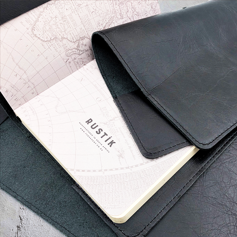 Image shows a black slip on leather cover with journal inner