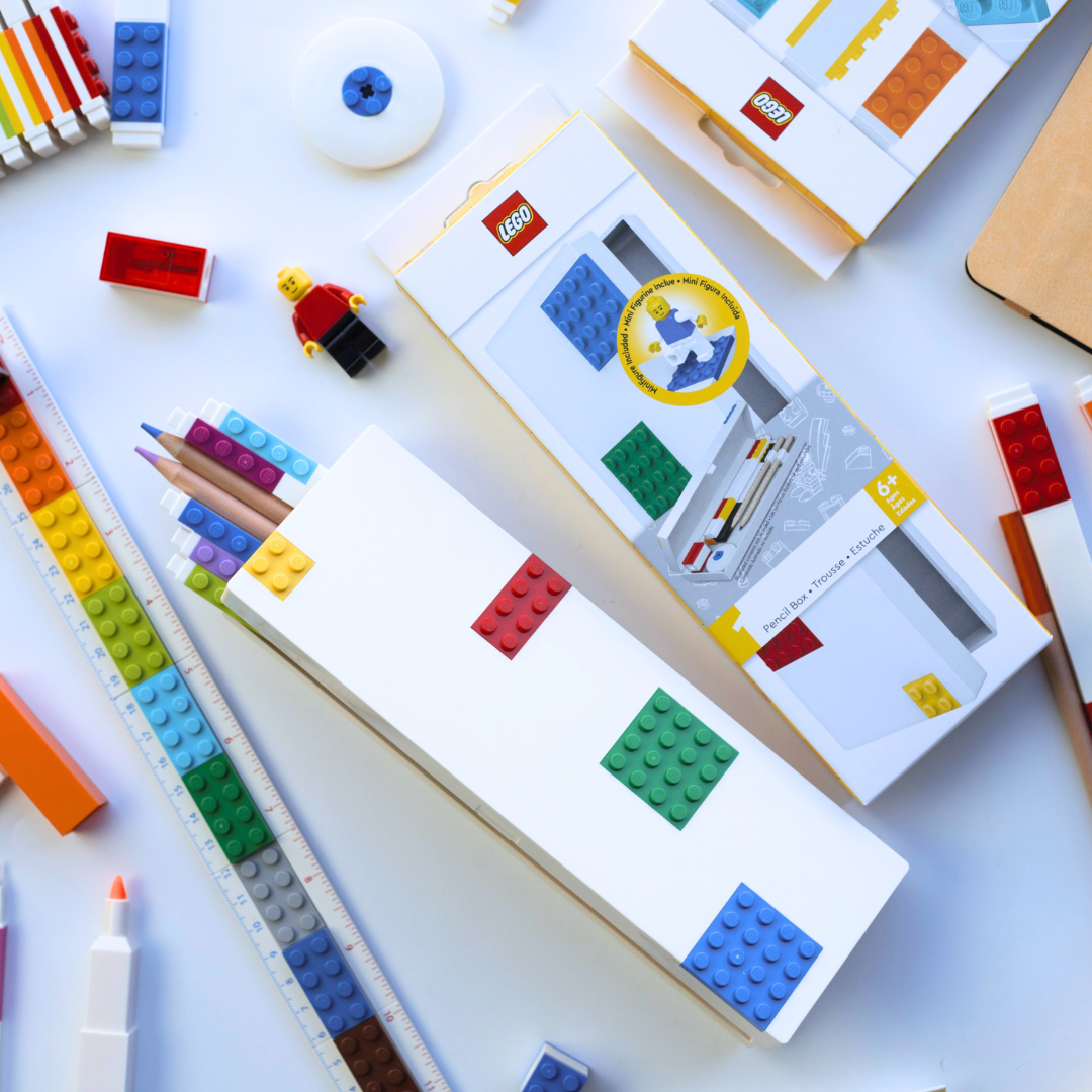 LEGO packaging with building blocks and tools on a white surface