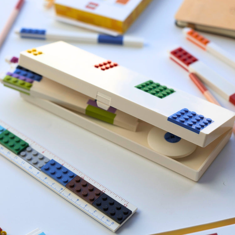 Pencil case with LEGO-style design on a white surface