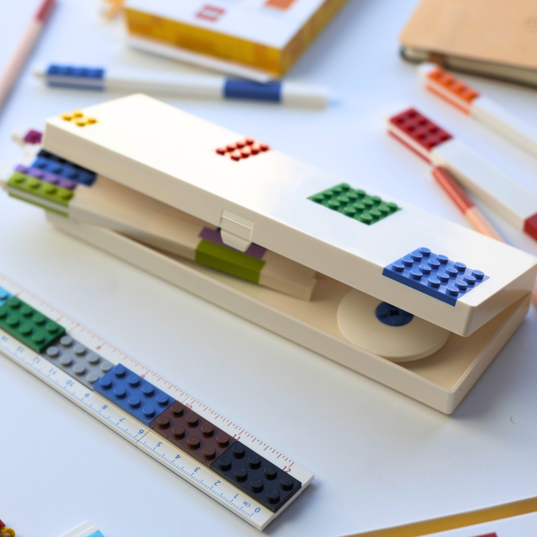 Pencil case with LEGO-style design on a white surface