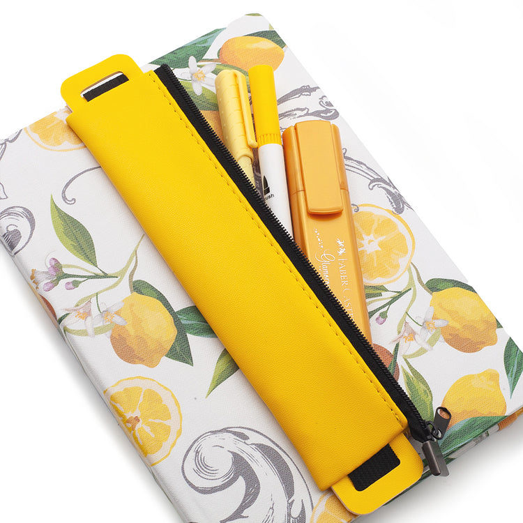 Image shows a yellow pencil pouch with a journal and pens
