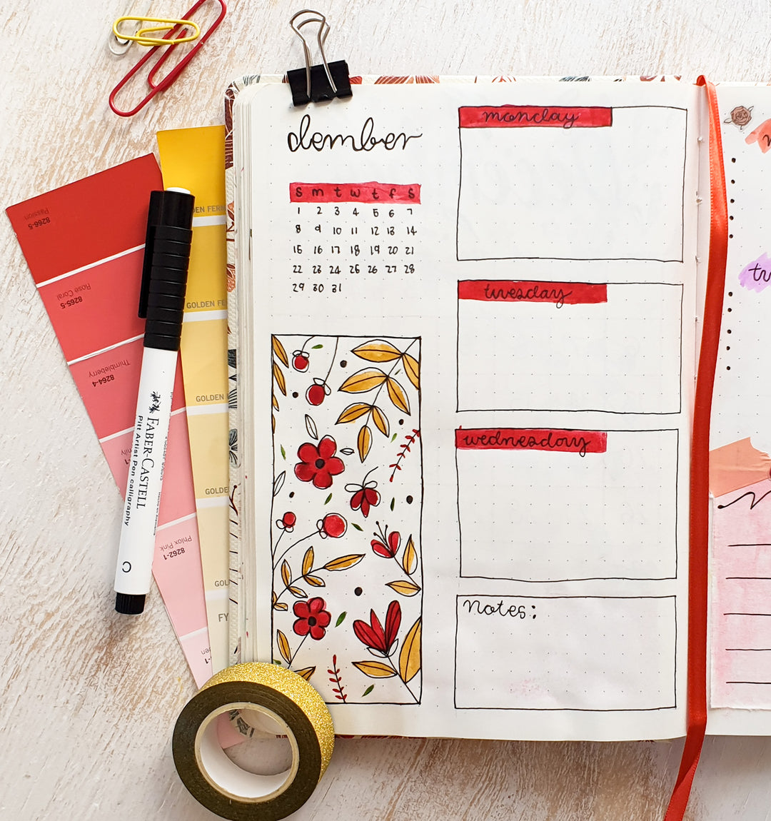 Image shows a journal spread in a premium dotted journal with red and yellow colours
