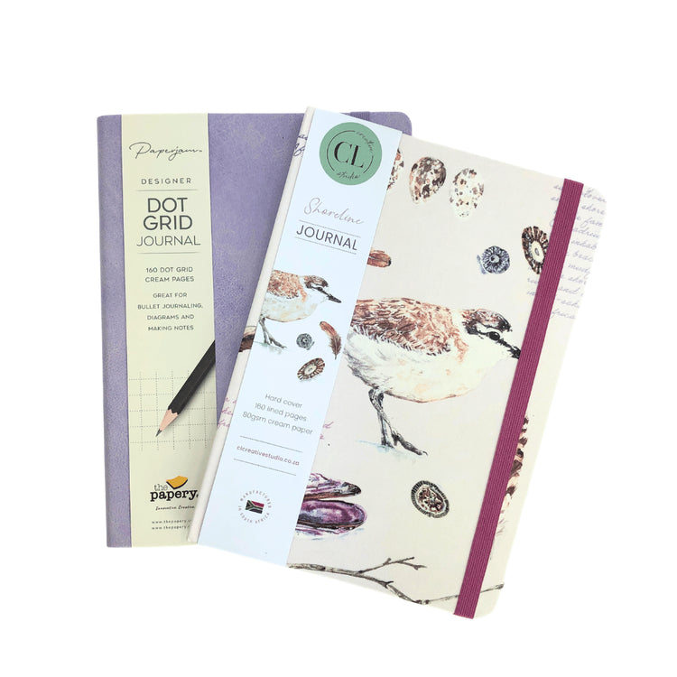 Two notebooks with different designs on a white background