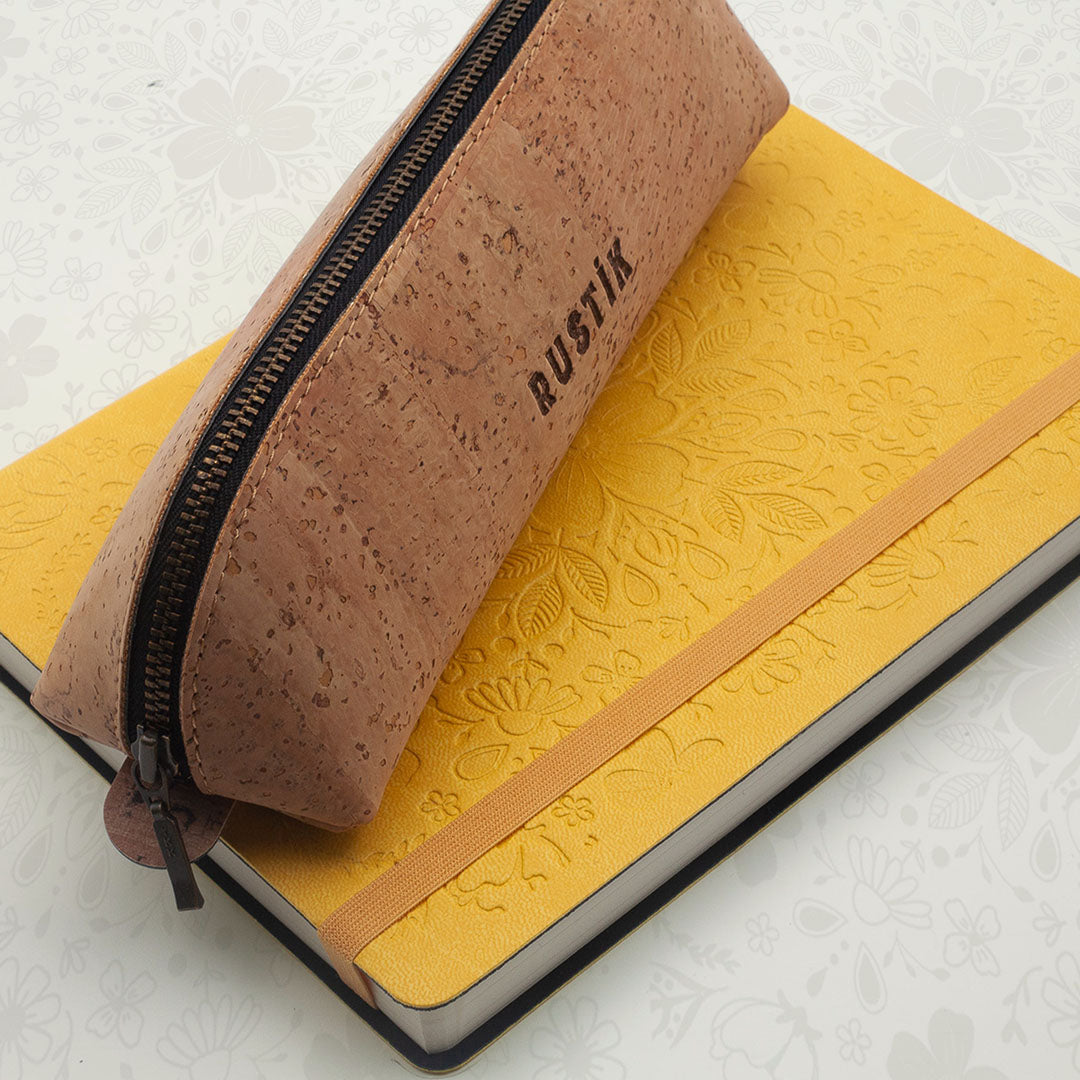 Image shows a yellow Premium dotted journal and a Rustik Cork pencil bag 