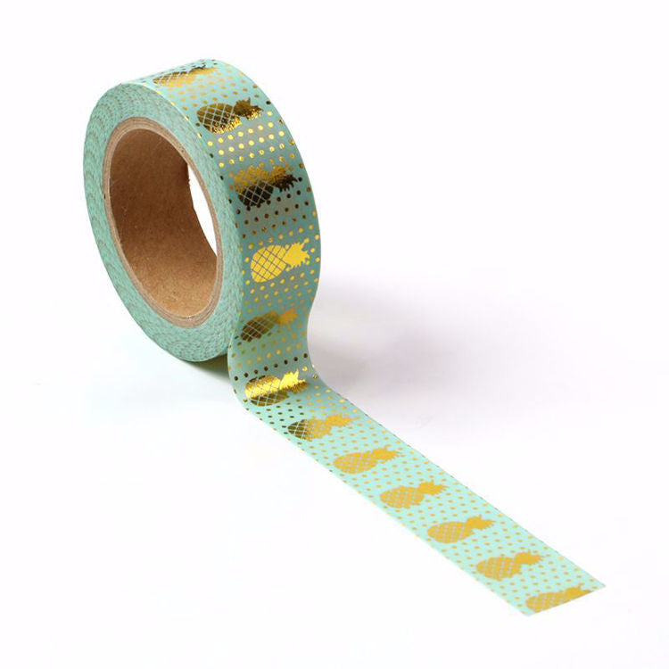 Image shows a blue with gold pineapples washi tape