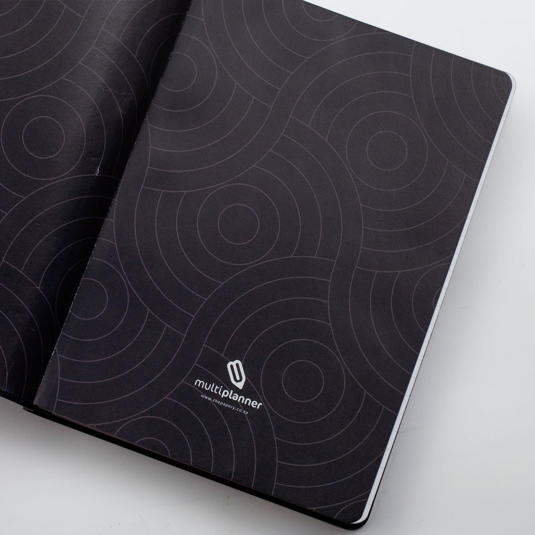 Image shows the endpapers of a black Flexi MultiPlanner