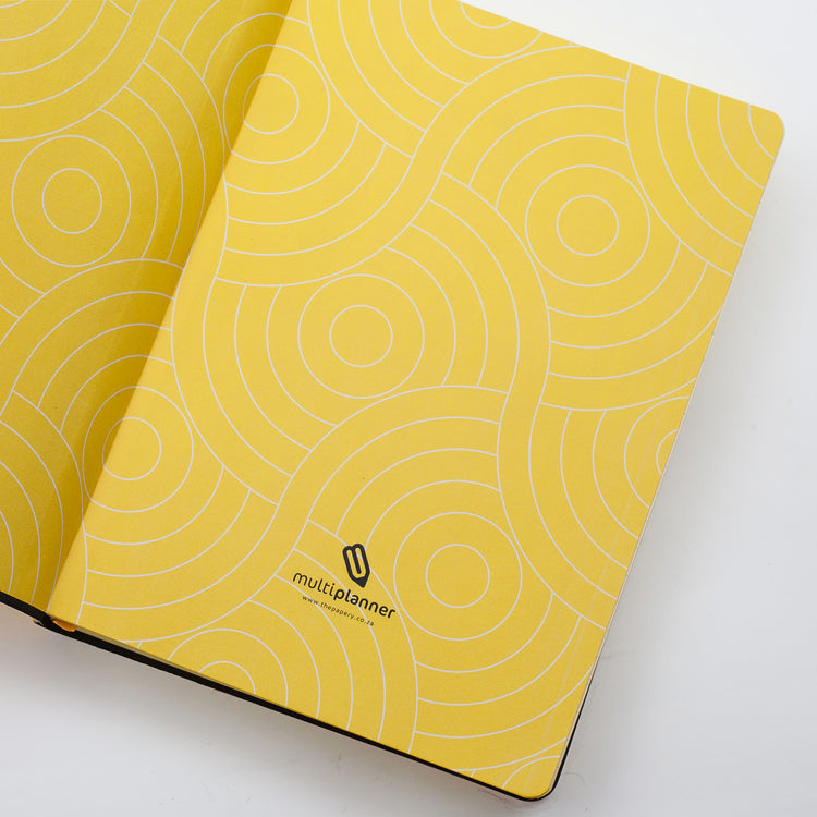 Image shows the endpapers of a yellow Flexi MultiPlanner