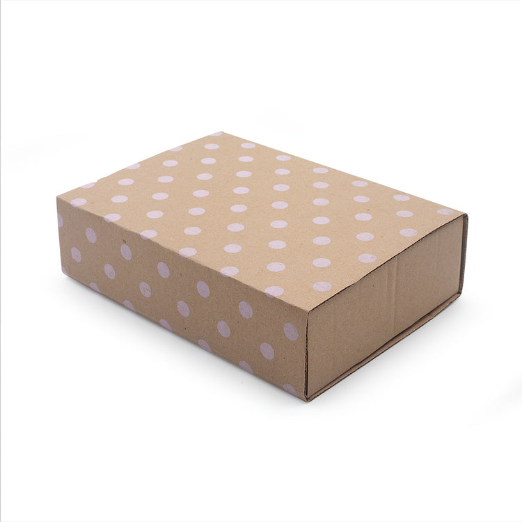 Image shows a gift box with pink polka dots
