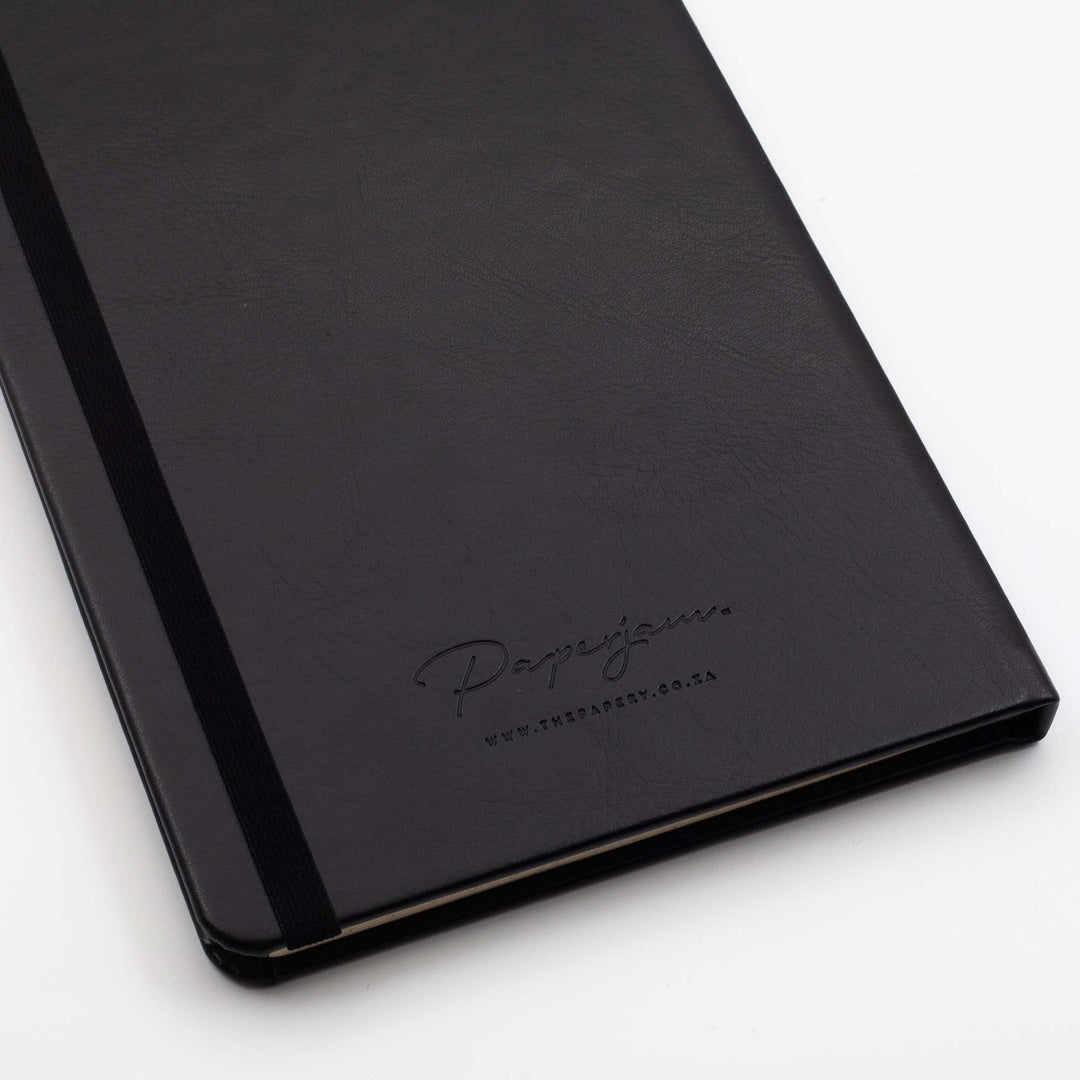 Image shows the back cover of a black Classic hardcover journal