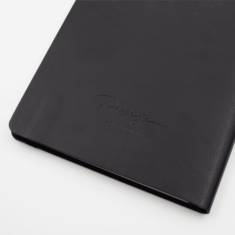 Image shows the back cover of a black Flexi softcover journal