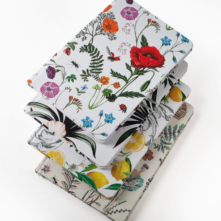 Image shows a top view group shot of the Floral hardcover journals