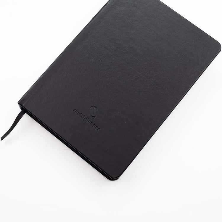 Image shows a top view of a Black Classic Multiplanner laying flat