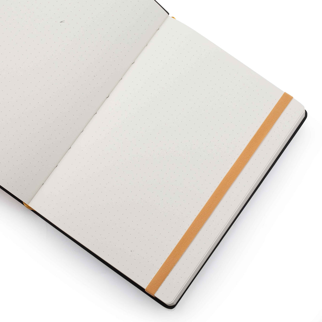 Image shows the dotted pages of a yellow Flexi Premium journal