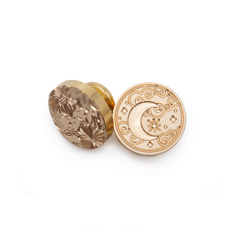 Image shows a wax seal stamp head, with a moon and floral design